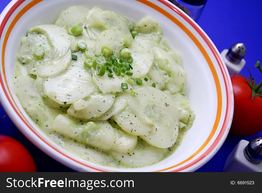 A salad of cucumbers with spring onions