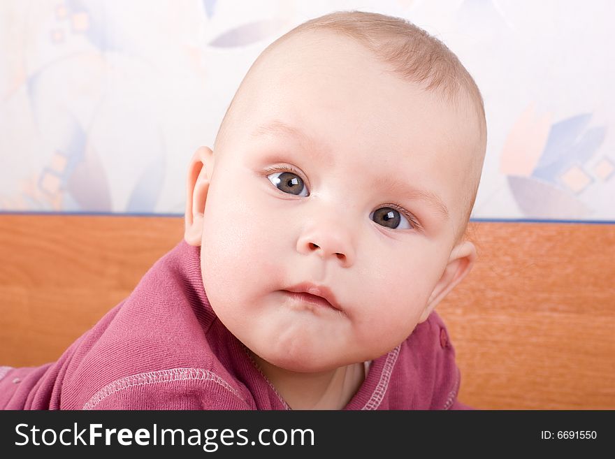 Attentive look of baby on photographer