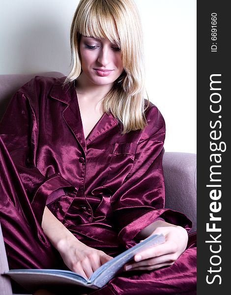 Blond model  is reading a book. Blond model  is reading a book