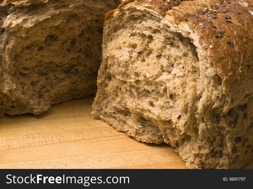 Closeup of a broken loaf of whole wheat bread. Closeup of a broken loaf of whole wheat bread