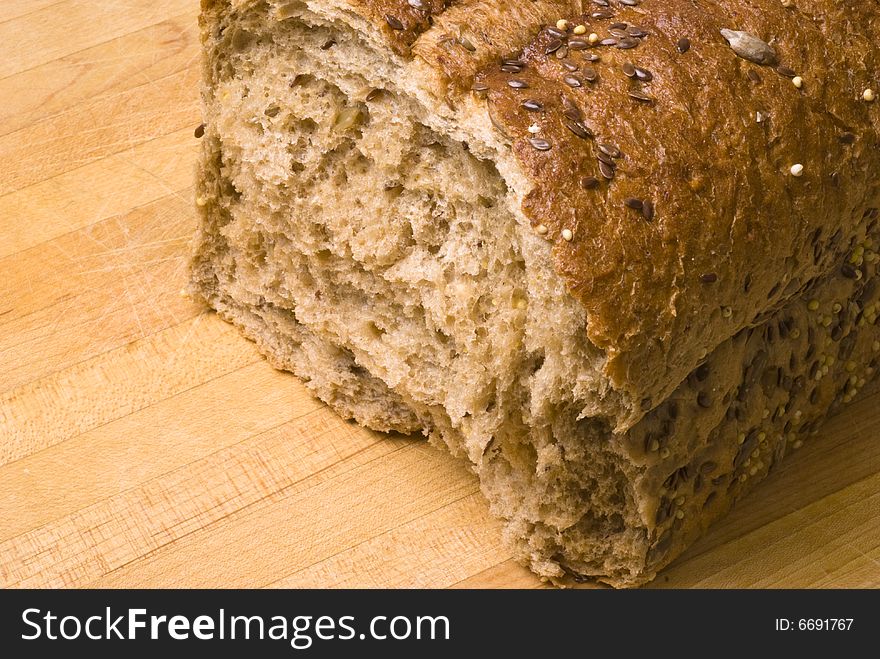 Closeup of a broken loaf of whole wheat bread. Closeup of a broken loaf of whole wheat bread