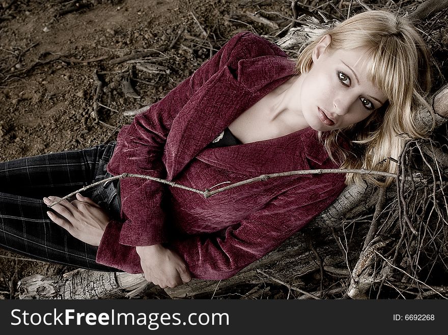 Fashion shoot of a beautiful girl in dead wood. Fashion shoot of a beautiful girl in dead wood