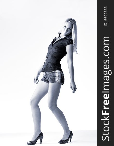 Studio full body portrait of a young blond posing. Studio full body portrait of a young blond posing