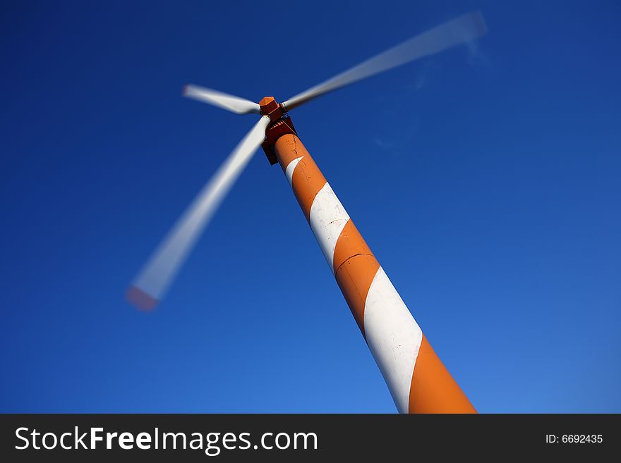 Wind turbine making green electricity. Wind turbine making green electricity