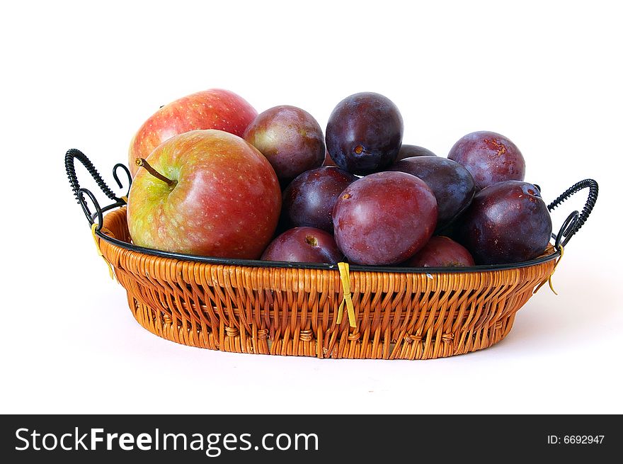 Basket of fruits isolated on a white background