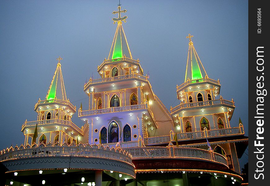 Illuminated church building during the opening celebration and blessing.