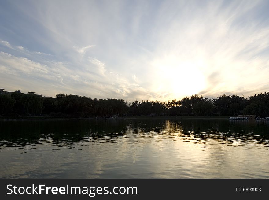 The setting sun in park.