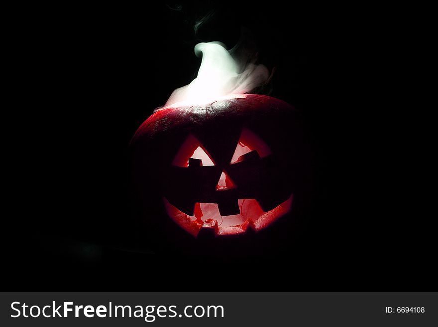 Halloween pumpkin with smoking crown of the head. Halloween pumpkin with smoking crown of the head
