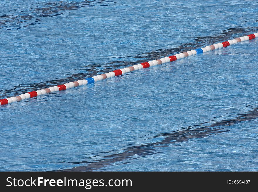 Bright blue water in swimming pool