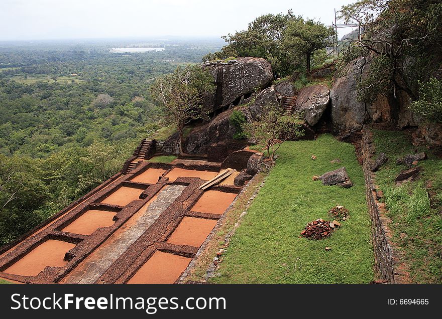 On top of a very high mountain in sri lanka you find old castle and temple ruins. On top of a very high mountain in sri lanka you find old castle and temple ruins