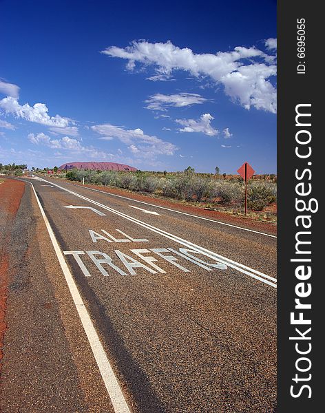 â€œAll Trafficâ€ to Uluru. Road markings directing the traffic to Australiaâ€™s famous monolith, Uluru (Ayers Rock). Uluru â€“ Kata Tjuta National Park, Northern Territory, Australia. â€œAll Trafficâ€ to Uluru. Road markings directing the traffic to Australiaâ€™s famous monolith, Uluru (Ayers Rock). Uluru â€“ Kata Tjuta National Park, Northern Territory, Australia.