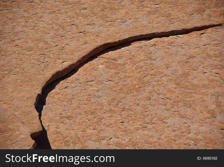 The beautiful textured surface of Australiaâ€™s famous monolith, Uluru (Ayers Rock), Uluru â€“ Kata Tjuta National Park, Northern Territory, Australia. The beautiful textured surface of Australiaâ€™s famous monolith, Uluru (Ayers Rock), Uluru â€“ Kata Tjuta National Park, Northern Territory, Australia.