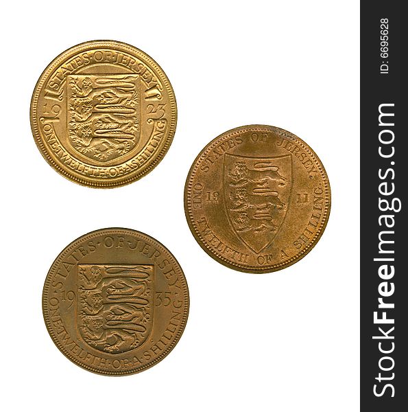 Three gold jersey coins of one twelfth of a shilling on white background