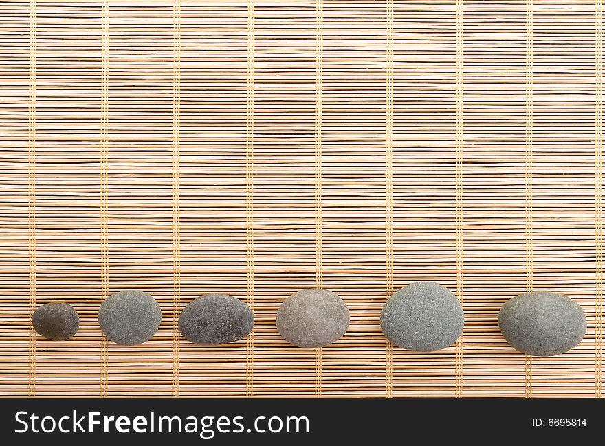 Balanced stones isolated on wooden background