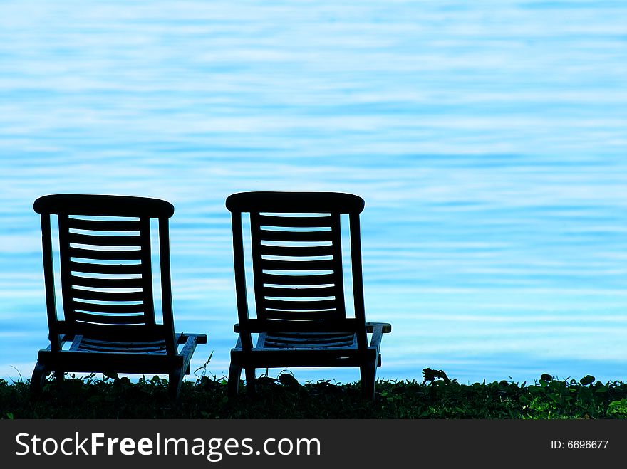 Two beach chairs on beach. Two beach chairs on beach