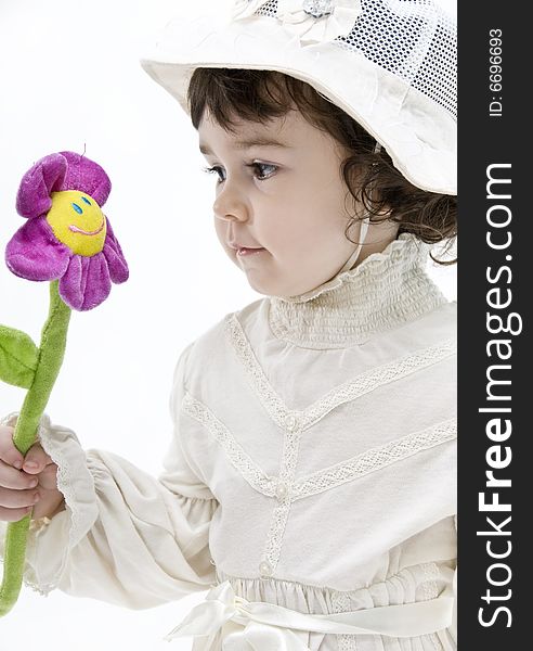 Portrait of a be single little girl with a flower