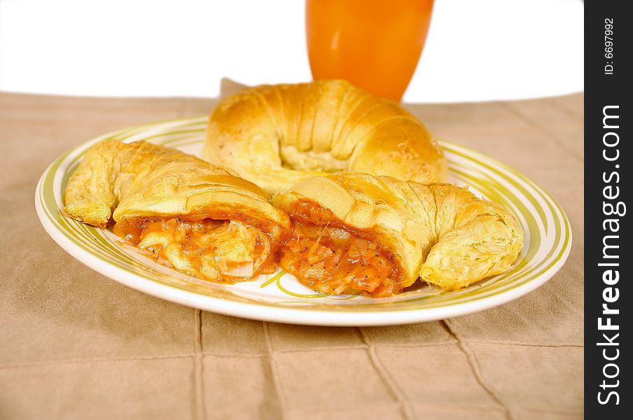 Pizza croissants filled with chicken and tomato sauce