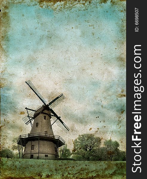 Windmill on a grunge background with copyspace for your own text.