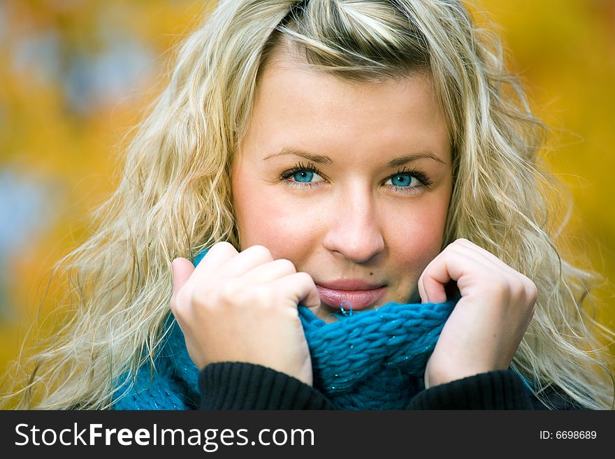 Young woman in autumn yellow forest