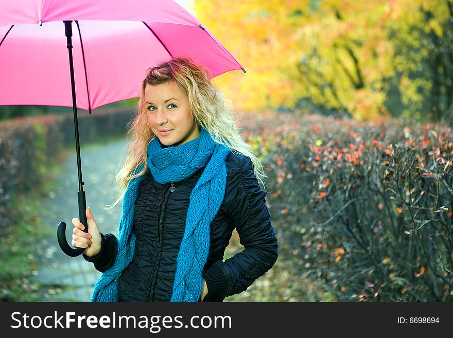 Young woman in autumn yellow forest