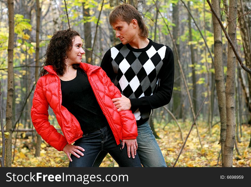 Enamoured  couple  in autumn wood. Enamoured  couple  in autumn wood