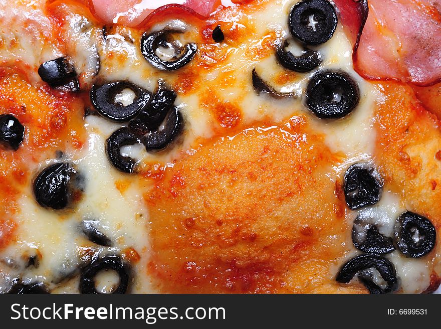 Top view of pizza on white background; extreme close up