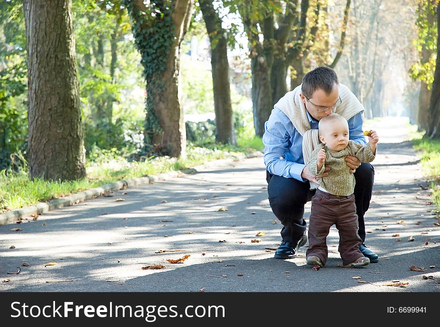 Father and son park autumn. Father and son park autumn