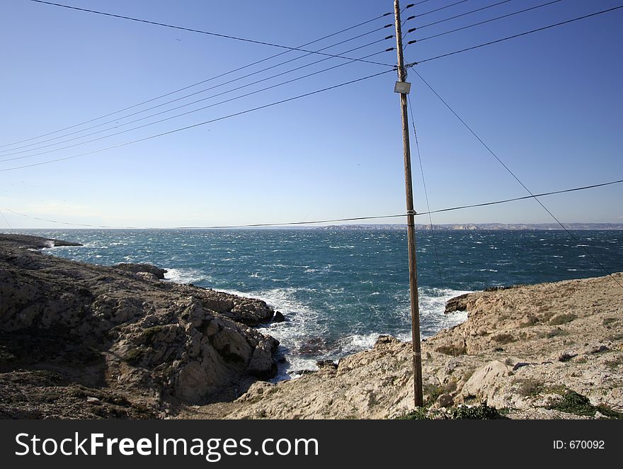 Telegraph poles on the shore-line at les goudes, marseille, france. Telegraph poles on the shore-line at les goudes, marseille, france