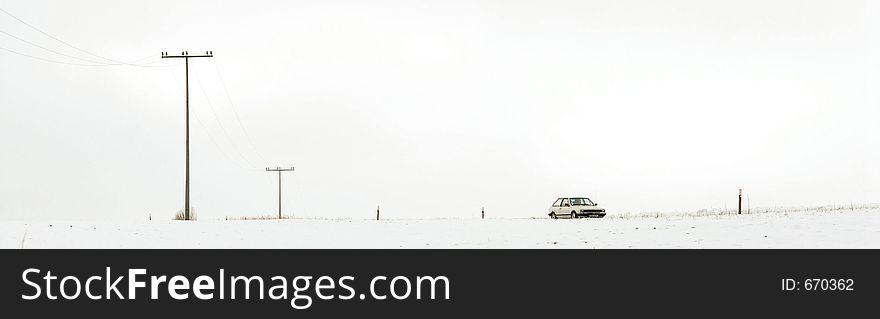 White car in White Snow Landscape. White car in White Snow Landscape