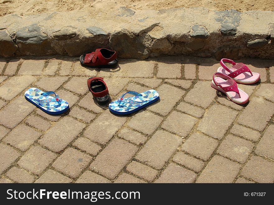 Children's shoes at the beach