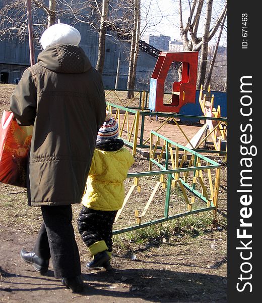 Grandmother walking with grandson. Grandmother walking with grandson