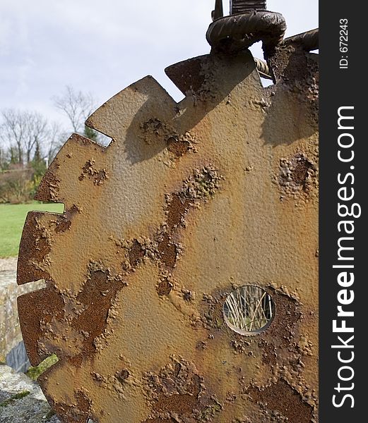 A section of rusty cog wheel. A section of rusty cog wheel.