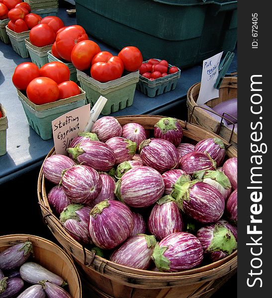 Basket of eggplants and tomato's. Basket of eggplants and tomato's