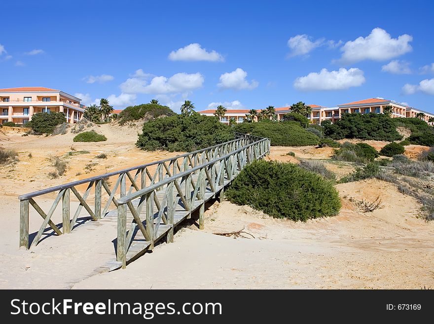Wooden walkway on sandy beach in Spain