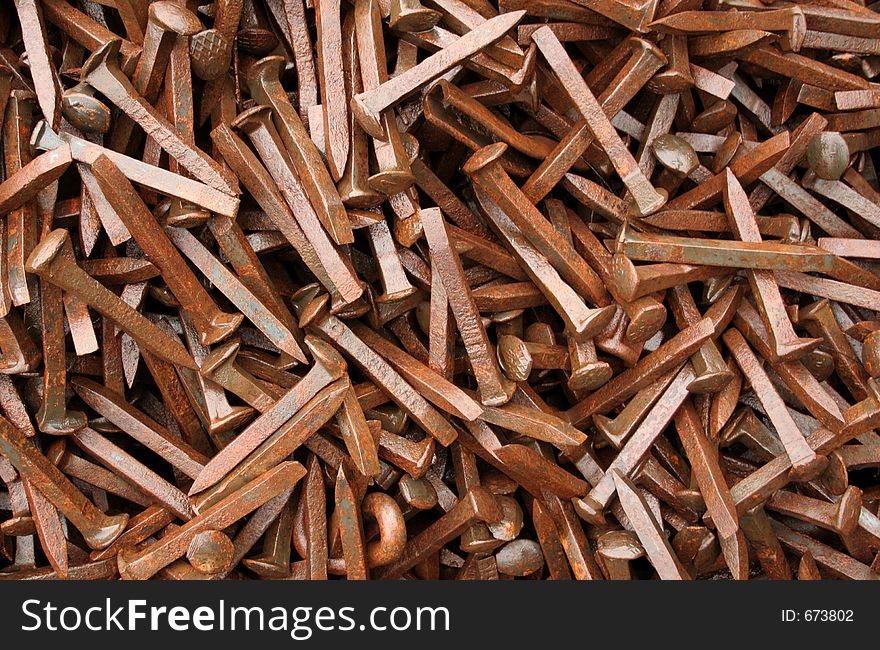 Thousands of rusty railway spikes. Thousands of rusty railway spikes.