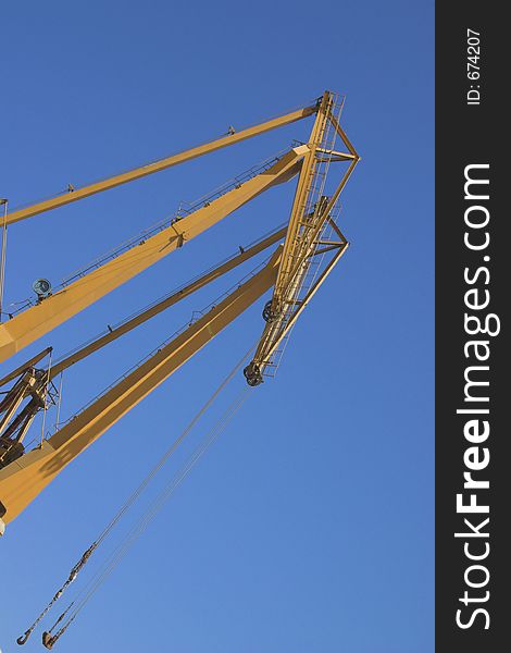 Yelow crane and blue sky. Yelow crane and blue sky