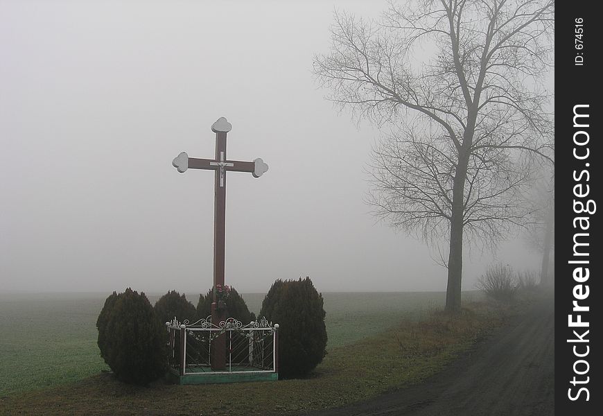 Village chapel in the foggy day