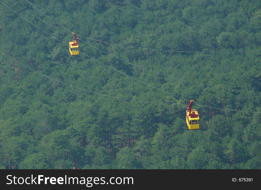 Cable car above a wood, crimea, mountain ajpetri