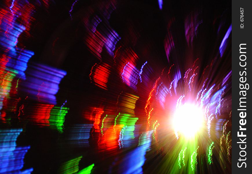 Colorful light from optical fibres vase obteind with long exposure and slow movement of fibres