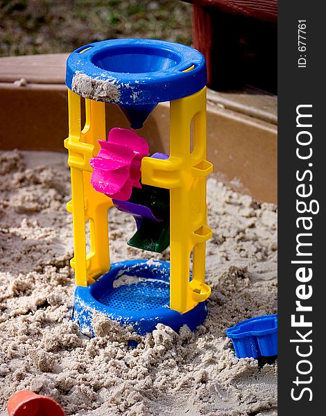 Multi-colored Toy in Sandbox