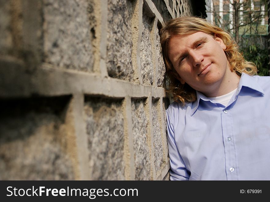 Man leaning on a wall. Man leaning on a wall