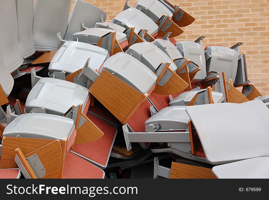Pile of auditorium chairs during remodeling
