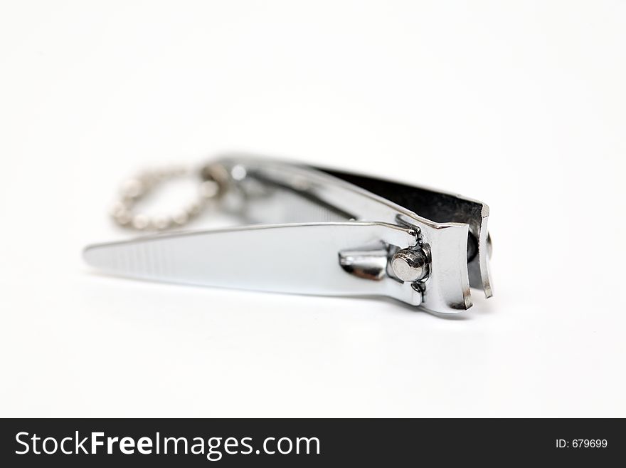 Close up shot of shiny metal nail clippers with white isolated background. Close up shot of shiny metal nail clippers with white isolated background