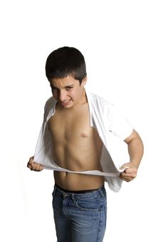Teenage Boy Is Ripping His Shirt Royalty Free Stock Images