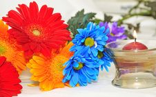 Colorful Flowers Bunch And Candle Royalty Free Stock Photo