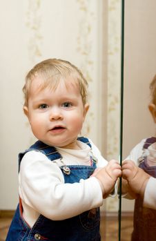 Small Smiling Baby Playing With Mirror Royalty Free Stock Images