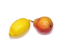 Fresh Yellow Lemon And Red Pear Royalty Free Stock Photos