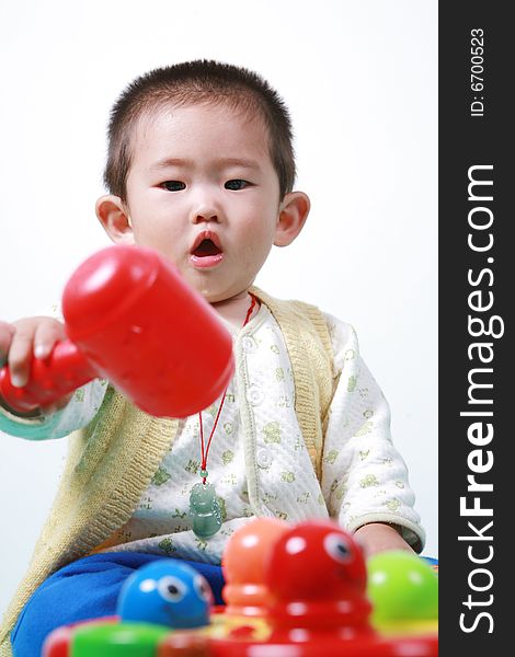 Young chinese boy play with toy. Young chinese boy play with toy