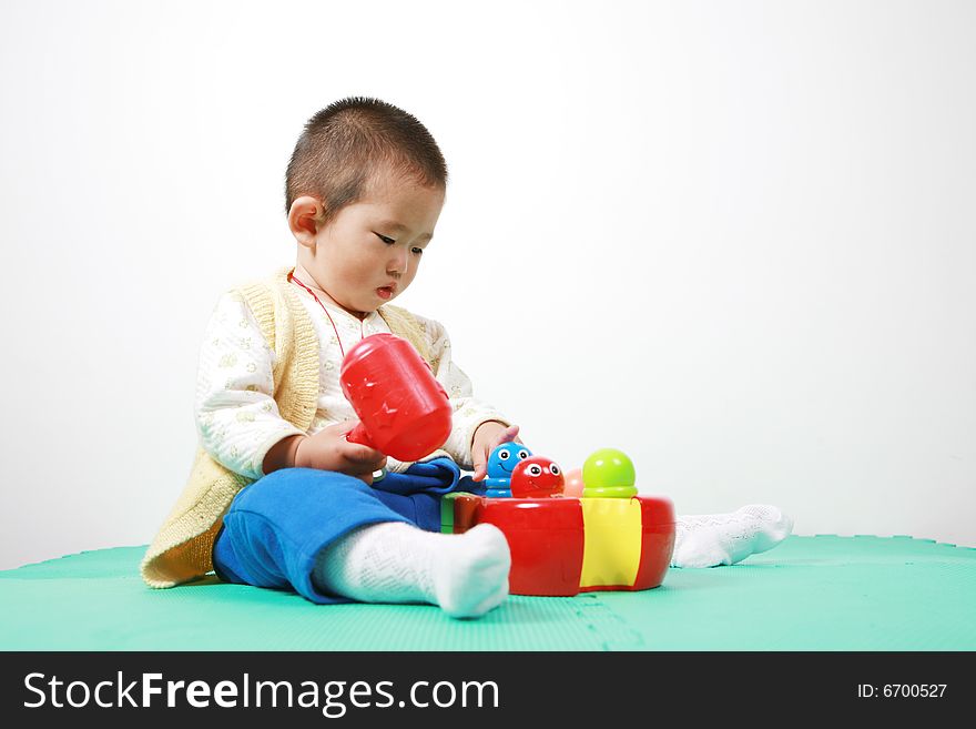 Young chinese boy play with toy. Young chinese boy play with toy