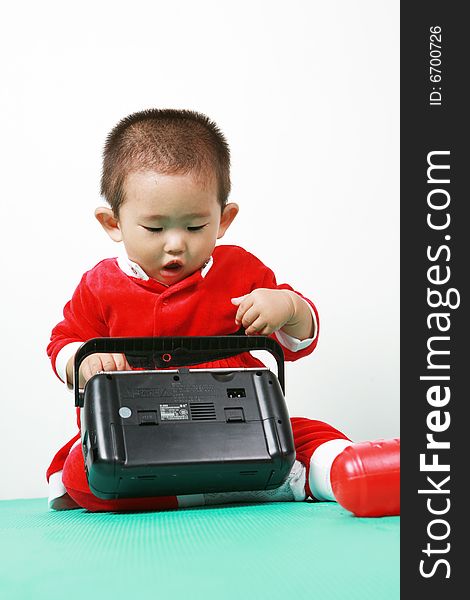 Cute chinese baby boy in a santas outfit. Cute chinese baby boy in a santas outfit